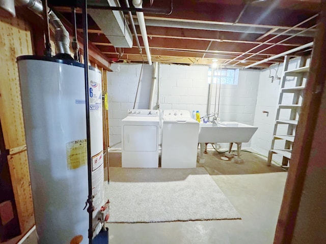 laundry room with sink, gas water heater, and independent washer and dryer