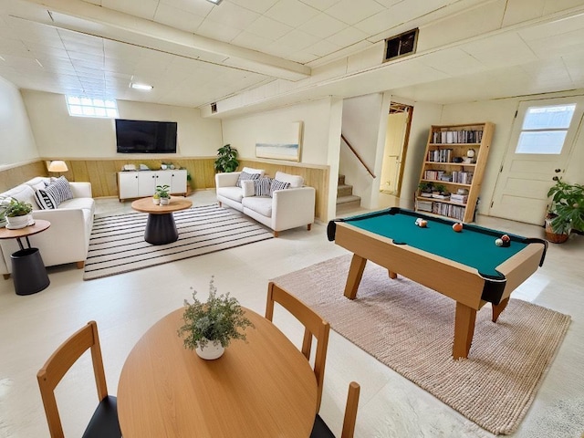 rec room with wood walls and billiards