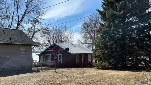 view of home's exterior with roof with shingles