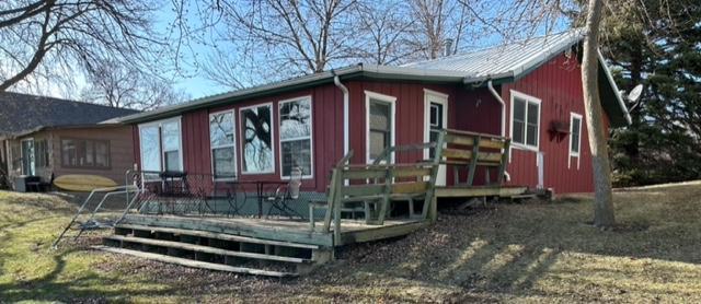 view of side of property featuring a deck