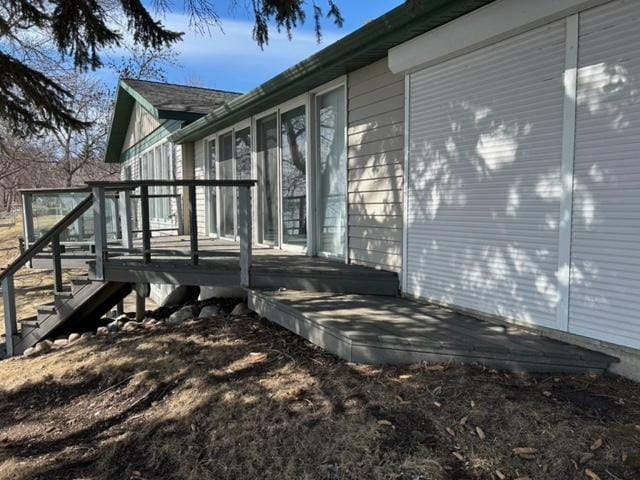 view of side of property featuring a deck