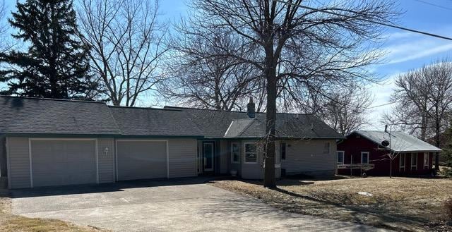 single story home with an attached garage and driveway