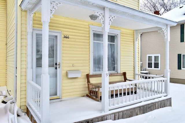 view of snow covered property entrance