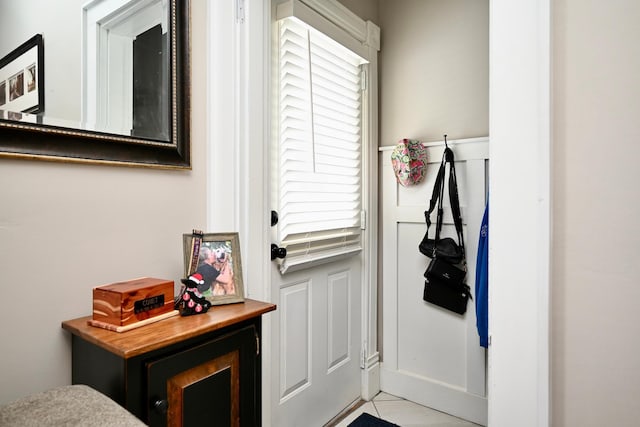 doorway to outside featuring light tile patterned floors