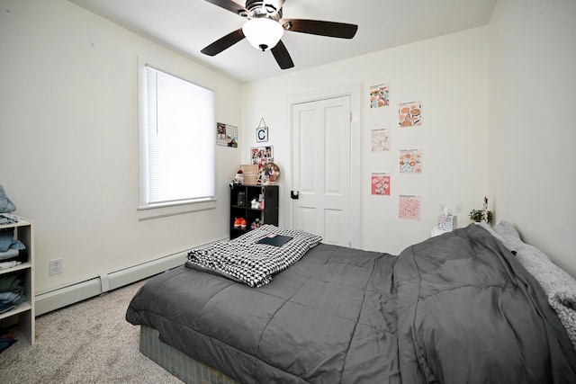 bedroom with carpet flooring, baseboard heating, and ceiling fan