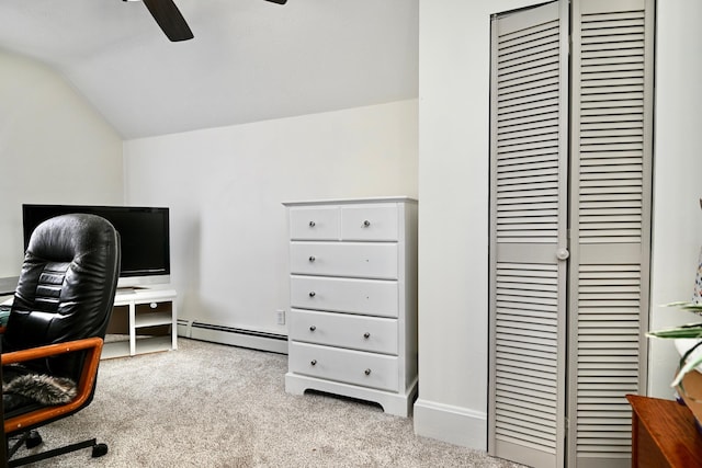 carpeted office space featuring baseboard heating, lofted ceiling, and ceiling fan