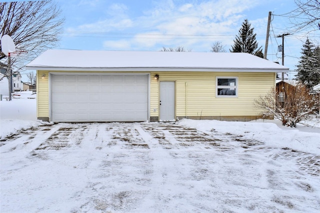 view of snow covered garage