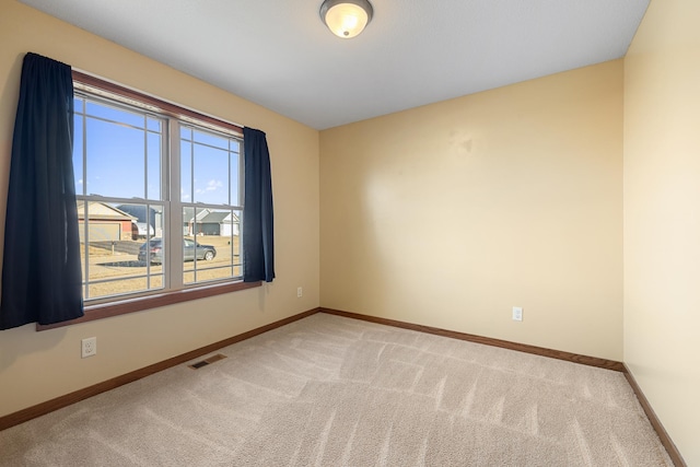 unfurnished room featuring carpet flooring