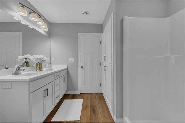 bathroom featuring vanity and wood-type flooring