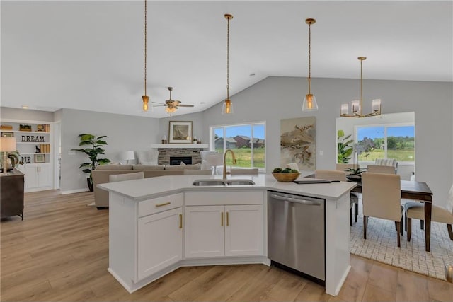 kitchen featuring dishwasher, white cabinetry, sink, and a kitchen island with sink