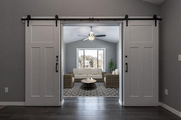 foyer entrance featuring dark hardwood / wood-style flooring, a barn door, vaulted ceiling, and ceiling fan