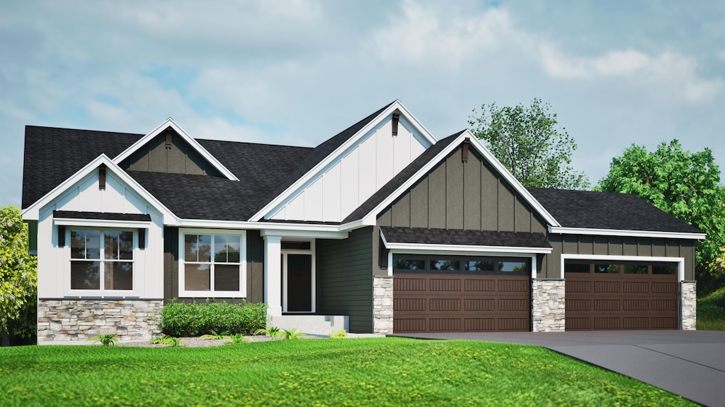 craftsman-style home featuring a front yard and a garage