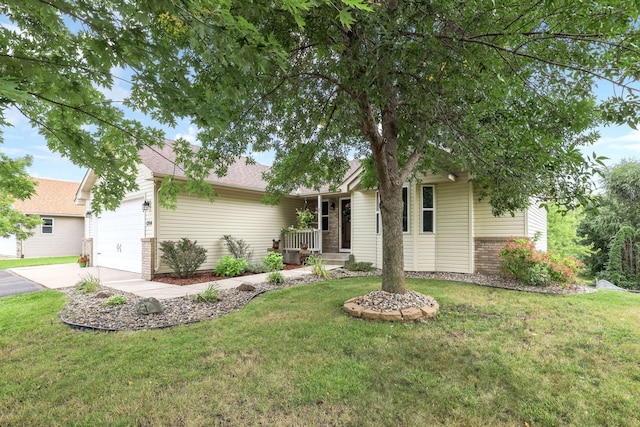 view of front of house featuring a garage and a front yard