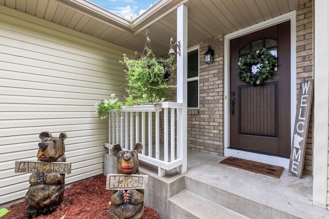 property entrance featuring covered porch