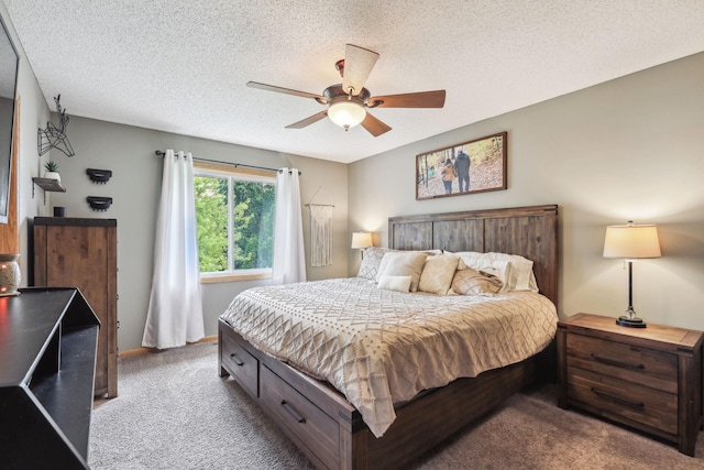 bedroom featuring ceiling fan, carpet floors, and a textured ceiling