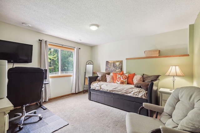 carpeted bedroom featuring a textured ceiling