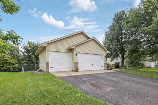 garage with a lawn