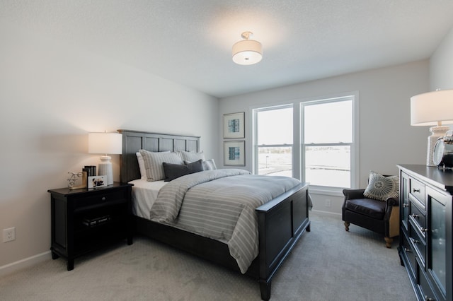 bedroom featuring light carpet