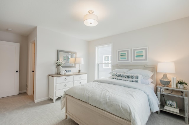 bedroom with light colored carpet