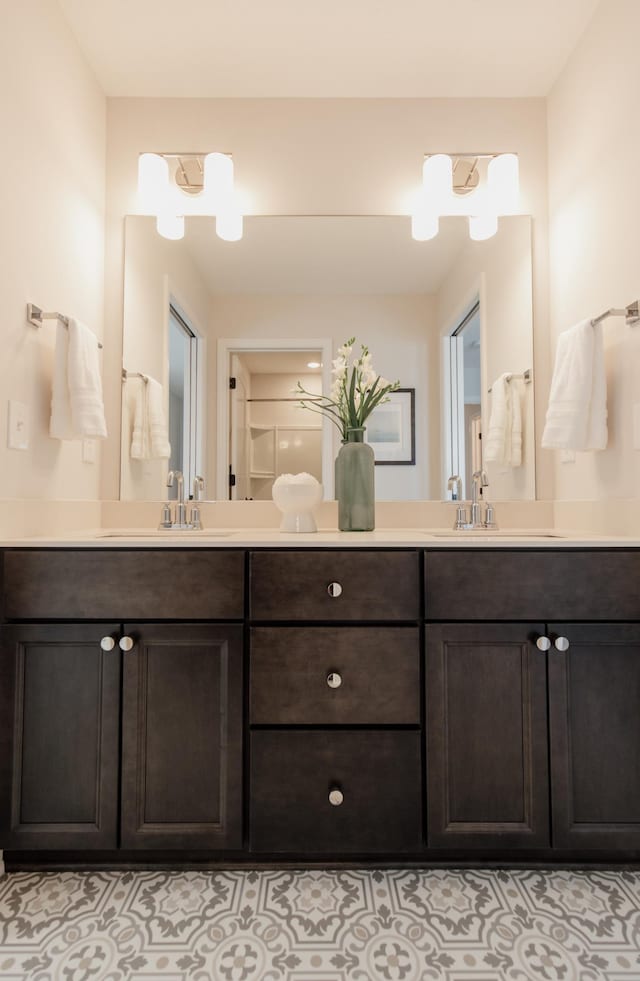 bathroom with tile patterned flooring and vanity