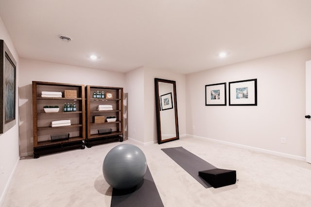 workout room with light colored carpet