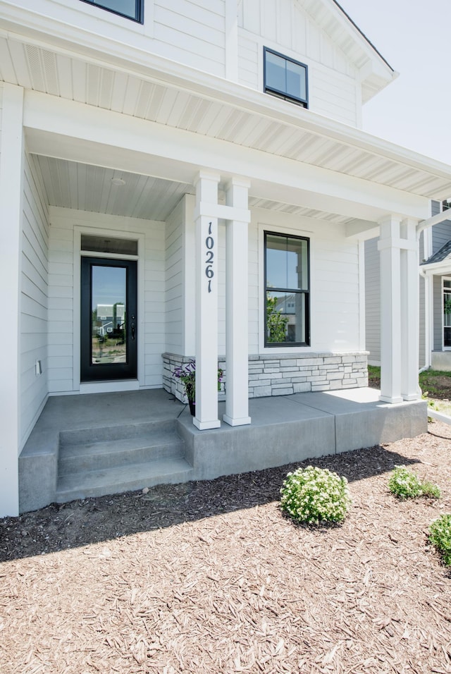 property entrance featuring covered porch