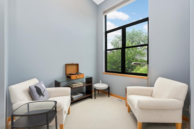 sitting room featuring carpet floors