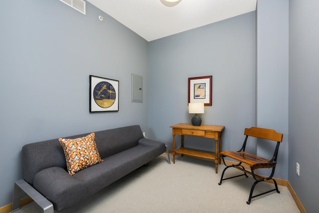 living area with carpet flooring and electric panel