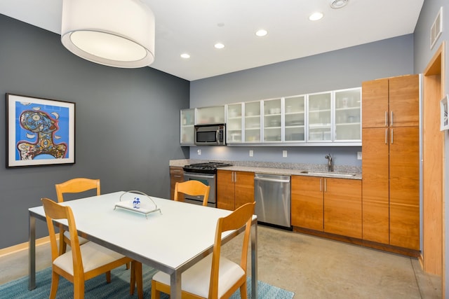 kitchen with sink and appliances with stainless steel finishes