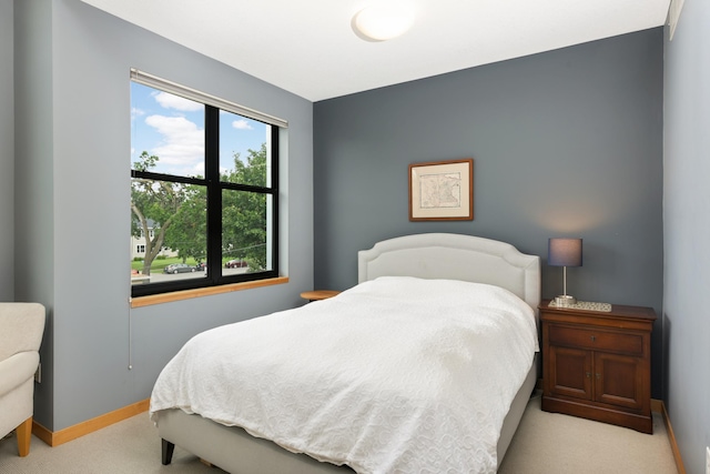 bedroom with light colored carpet