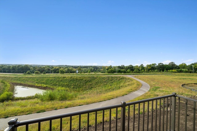 exterior space featuring a rural view and a water view