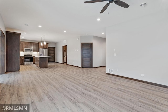 unfurnished living room with recessed lighting, light wood-type flooring, and ceiling fan