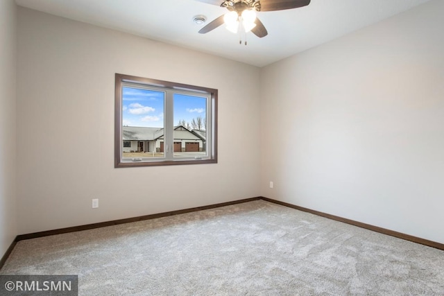 unfurnished room with carpet flooring, baseboards, and ceiling fan