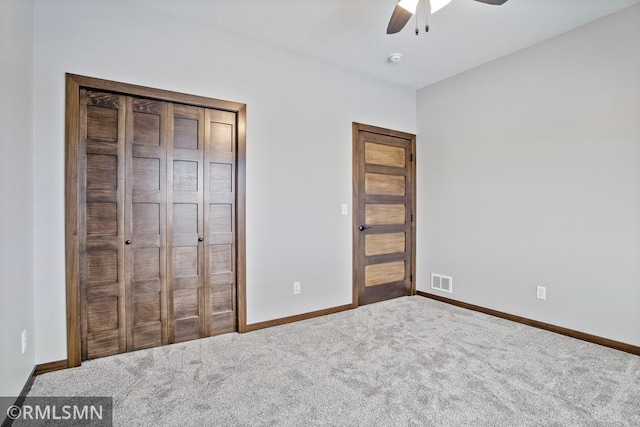 unfurnished bedroom with visible vents, carpet flooring, baseboards, and ceiling fan