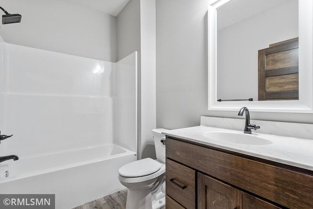 full bathroom with vanity, shower / bathing tub combination, toilet, and wood finished floors