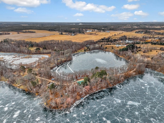 drone / aerial view with a water view and a rural view