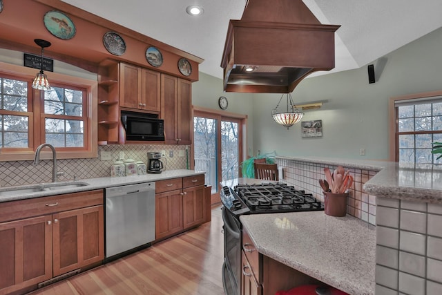 kitchen with decorative light fixtures, black microwave, dishwasher, sink, and gas range