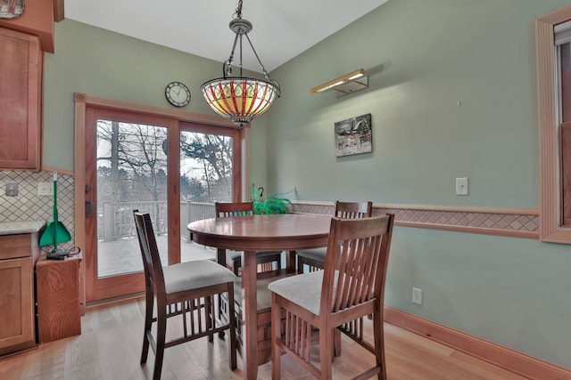 dining space featuring light wood-type flooring