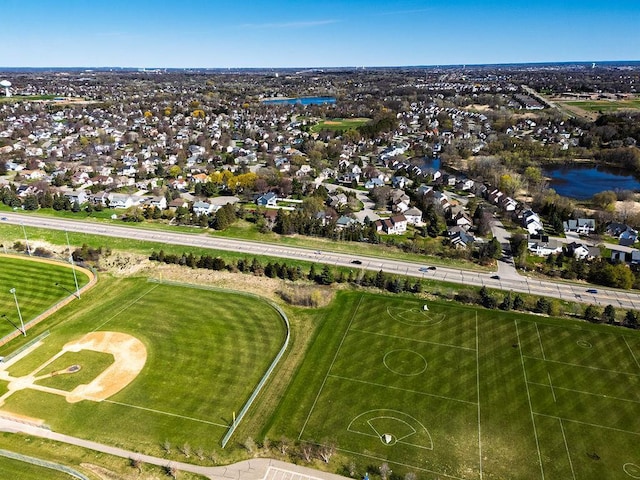 birds eye view of property featuring a residential view and a water view