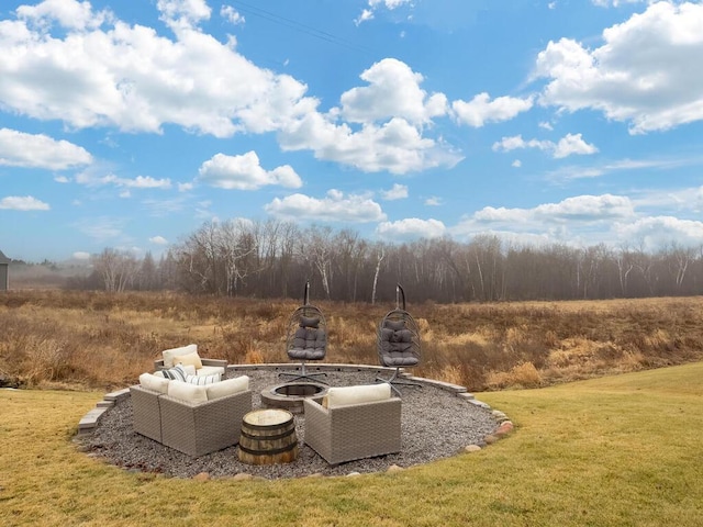 view of yard with an outdoor fire pit