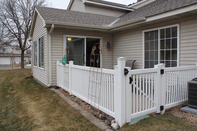 view of property exterior featuring a yard and central AC unit