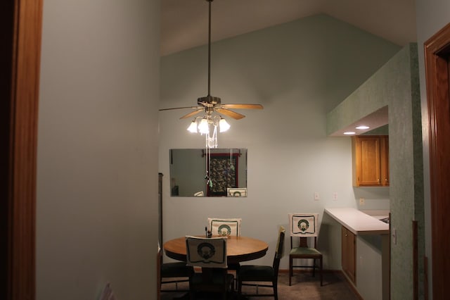 dining space featuring ceiling fan and lofted ceiling