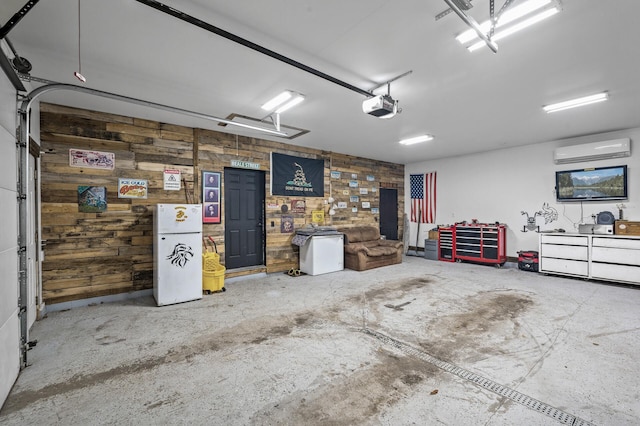 garage with a wall unit AC, a garage door opener, and wood walls