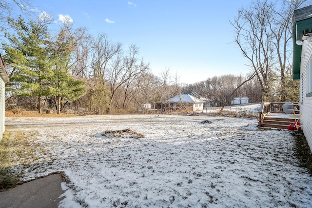 view of yard layered in snow