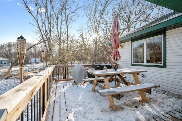 view of snow covered deck