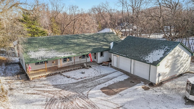 view of front of property featuring a garage and covered porch