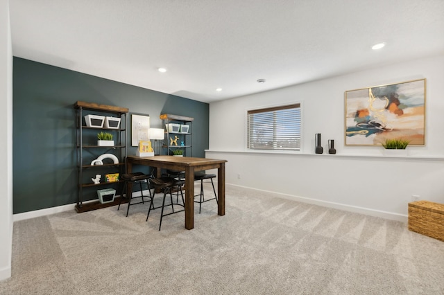 dining area featuring carpet flooring