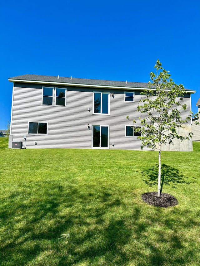 rear view of house with a lawn