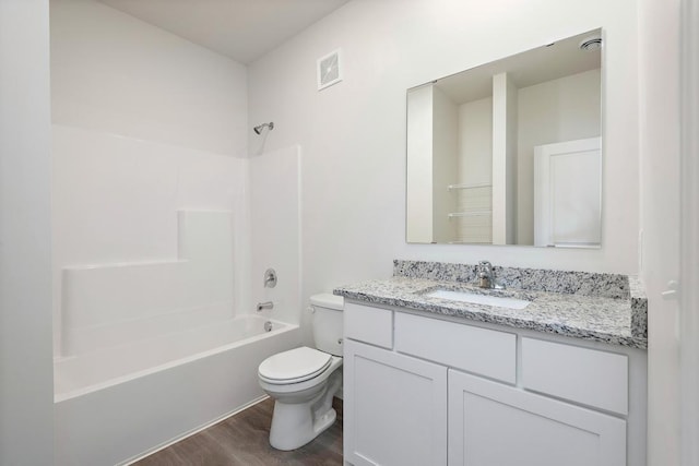 full bathroom featuring toilet, shower / washtub combination, vanity, and hardwood / wood-style flooring