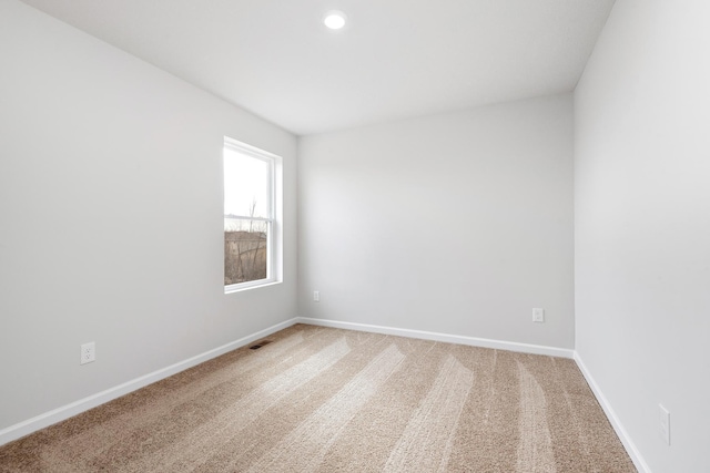 empty room featuring carpet flooring